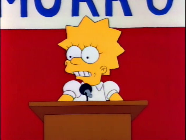 A screengrab from an early episode of The Simpsons. Lisa stands at a podium, her head barely peeking out from behind it, in front of a red curtain.